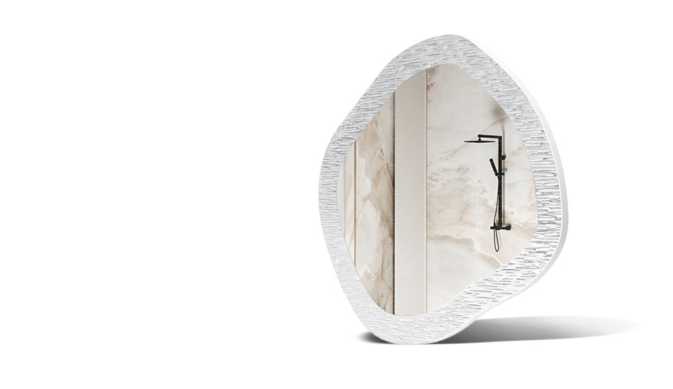Mirror in a frame with metal decoration. A symbol of modern elegance